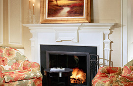 The Lenox wood burning fireplace and armchairs